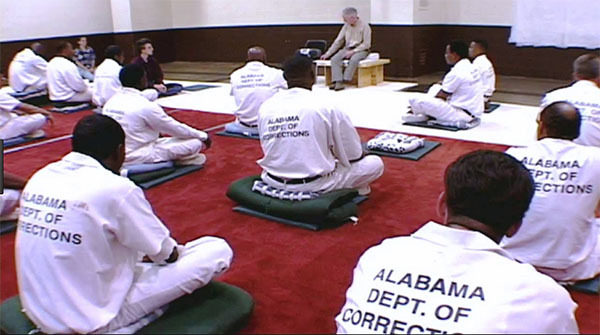 Image showing prisoners in a Dhamma Hall in a correction center in Alabama